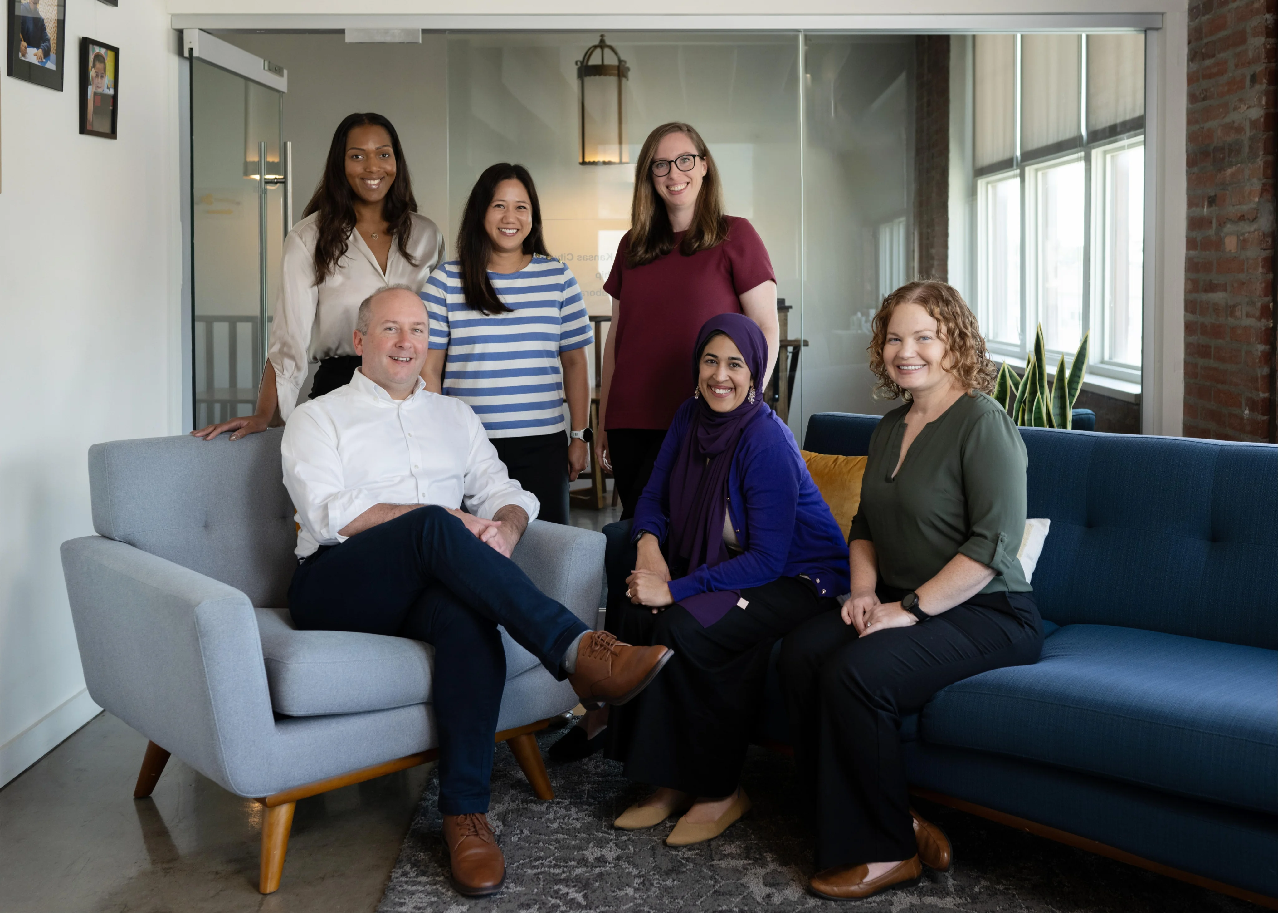 EdFuel team members posing together in a bright office.